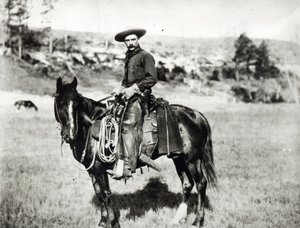 Cowboy riding a horse in Montana, USA, c. 1880